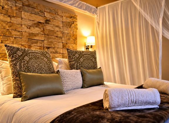 Luxury Bed with Rolled Towels.jpg