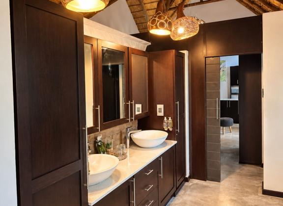 Warm Lodge-Style Double Vanity Bathroom.jpg